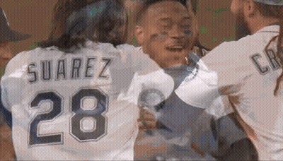 A Man Wearing A Suarez 28 Jersey Is Hugging Another Man GIF