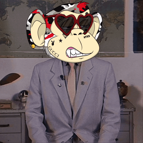 A Man Wearing A Suit And Tie Has A Monkey Face On His Head With The Word Gucci On It GIF