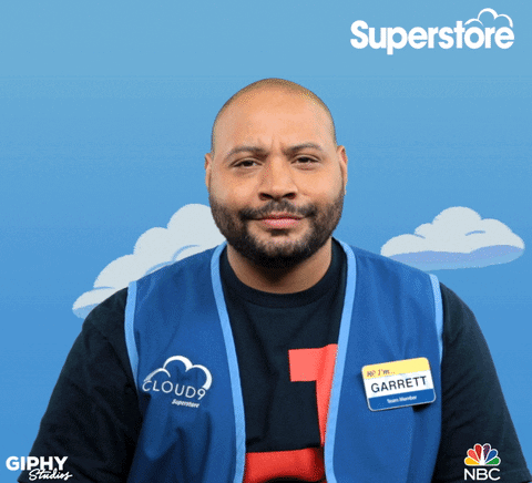 A Man Wearing A Superstore Vest And A Name Tag That Says Garrett GIF