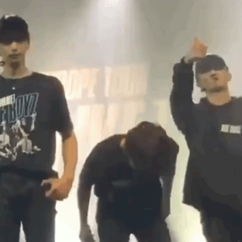 A Man Wearing A T-Shirt That Says Boyz Is Dancing On Stage GIF
