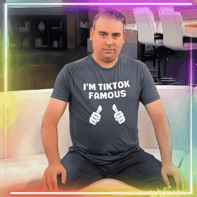 A Man Wearing A T-Shirt That Says " I 'M Tiktok Famous " GIF