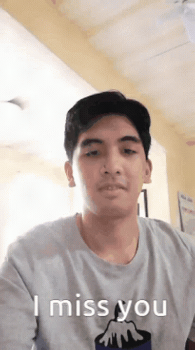 A Man Wearing A T-Shirt That Says " I Miss You " GIF