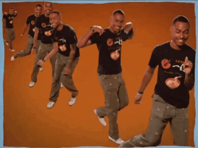 A Man Wearing A T-Shirt That Says ' Noodles ' On It Is Dancing GIF