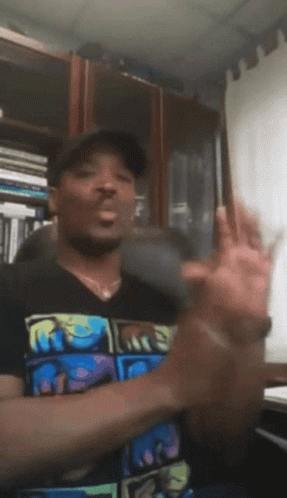 A Man Wearing A T-Shirt That Says R.i.p. GIF