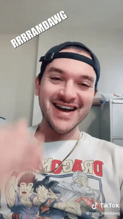 A Man Wearing A T-Shirt That Says ' Rrrramdawg ' On It GIF
