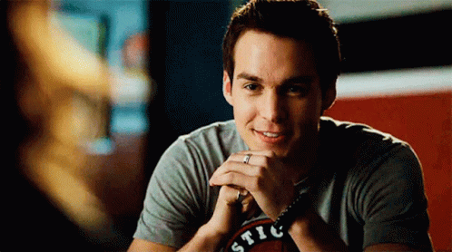 A Man Wearing A T-Shirt That Says ' Stic ' On It GIF