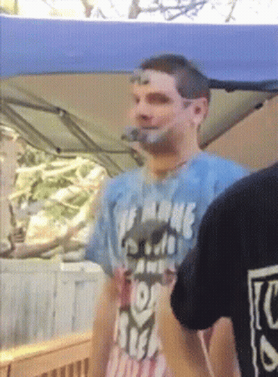 A Man Wearing A T-Shirt That Says The Name Of The Game Is Free GIF