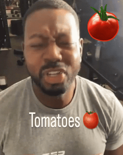 A Man Wearing A T-Shirt That Says Tomatoes On It GIF