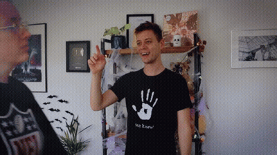A Man Wearing A T-Shirt That Says We Know GIF