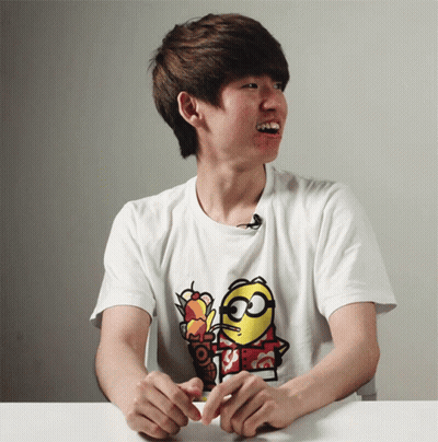 A Man Wearing A T-Shirt With A Minion On It GIF