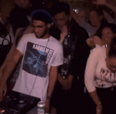 A Man Wearing A T-Shirt With The Word Karriem On It Is Playing Music GIF