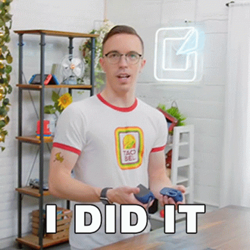 A Man Wearing A Taco Bell Shirt Is Holding A Video Game Controller And Says I Did It . GIF