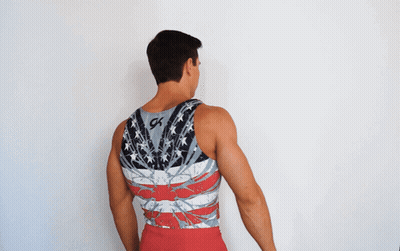A Man Wearing A Tank Top With The Word Usa On It GIF