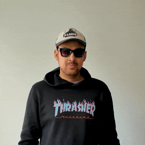 A Man Wearing A Thrasher Magazine Hoodie And Sunglasses GIF