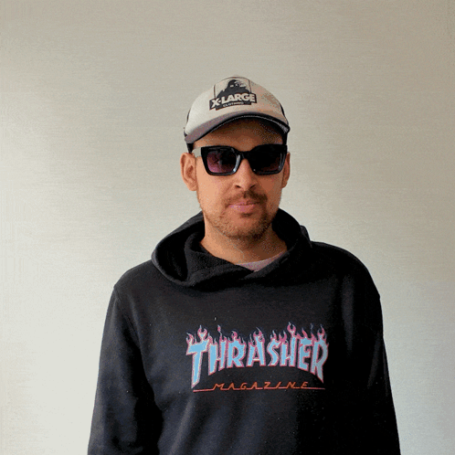 A Man Wearing A Thrasher Magazine Hoodie And Sunglasses GIF