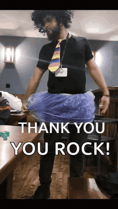 A Man Wearing A Tie And A Blue Skirt With The Words Thank You You Rock Below Him GIF