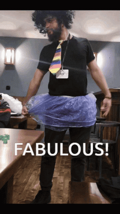 A Man Wearing A Tie And A Plastic Skirt Says Fabulous On The Bottom GIF