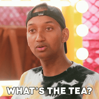 A Man Wearing A Tie Dye Shirt And A Baseball Cap Says " What 'S The Tea " GIF
