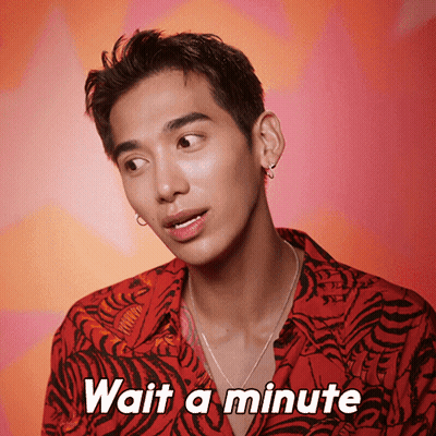 A Man Wearing A Tiger Print Shirt Says " Wait A Minute " GIF