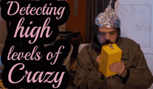 A Man Wearing A Tin Foil Hat Is Smoking A Box Of Cheese GIF