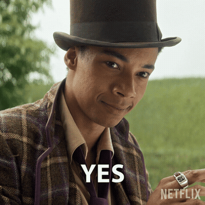 A Man Wearing A Top Hat And A Purple Tie Says Yes GIF