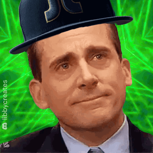 A Man Wearing A Top Hat With The Letter Jc On It GIF