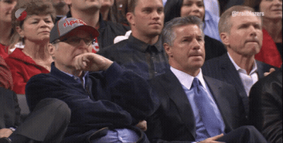 A Man Wearing A Trailblazers Hat Sits In The Stands GIF