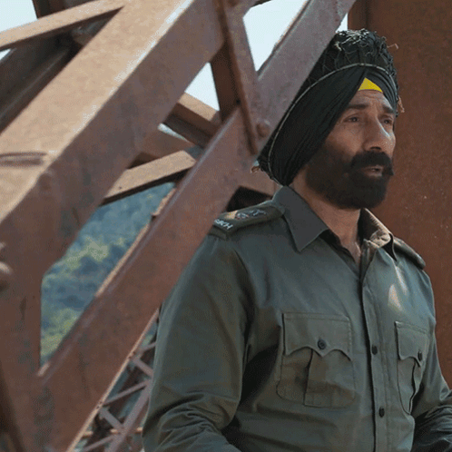 A Man Wearing A Turban And A Military Uniform With The Letters Army On The Sleeve GIF