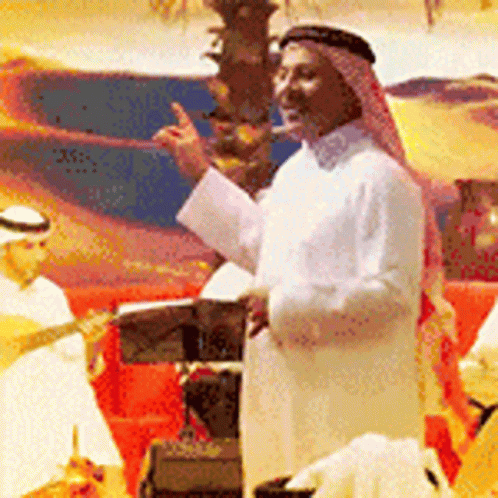 A Man Wearing A Turban Is Standing In Front Of A Podium And Giving A Speech GIF