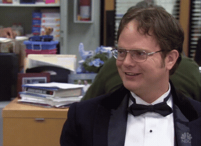 A Man Wearing A Tuxedo And Bow Tie Has A Nbc Logo On His Shirt GIF