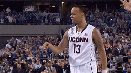 A Man Wearing A Uconn Jersey Number 13 GIF