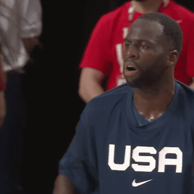 A Man Wearing A Usa Shirt Looks Surprised GIF