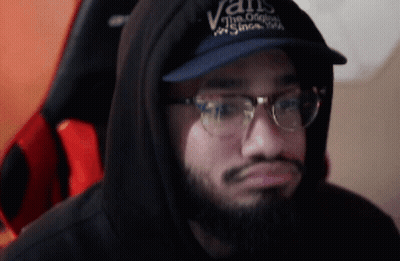A Man Wearing A Vans Hat And Glasses GIF