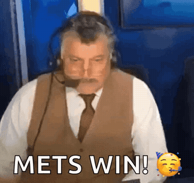 A Man Wearing A Vest And Tie Says Mets Win ! GIF