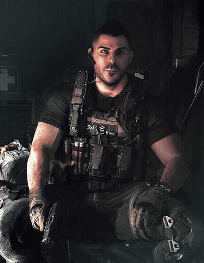 A Man Wearing A Vest That Says ' K2 D Pos ' On It GIF