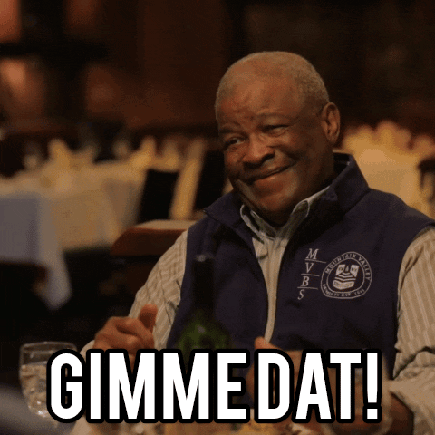 A Man Wearing A Vest That Says Mvrs On It Smiles And Says Gimme Dat GIF