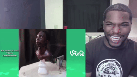 A Man Wearing A Vine T-Shirt Is Laughing GIF