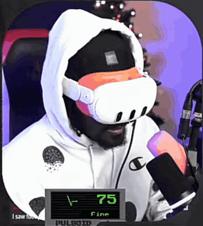 A Man Wearing A Virtual Reality Headset Is Sitting In Front Of A Microphone And A Sign That Says 75 Fine GIF