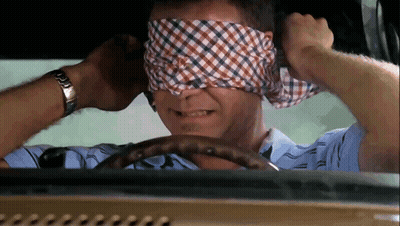 A Man Wearing A Watch Is Blindfolded While Driving GIF