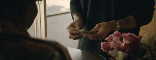 A Man Wearing A Watch Is Holding A Bunch Of Money In His Hands GIF