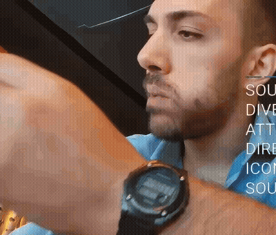 A Man Wearing A Watch With The Words Sou Dive Att Dire Icon Soc On The Bottom GIF