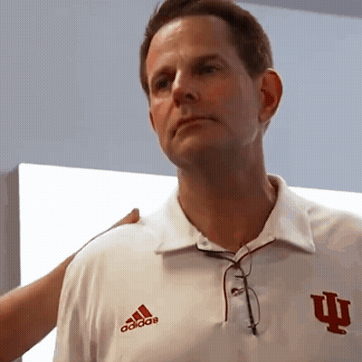 A Man Wearing A White Adidas Shirt With The Letter I On The Front GIF