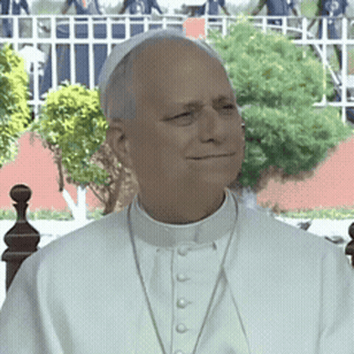 A Man Wearing A White Collared Shirt And A White Hat GIF