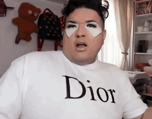 A Man Wearing A White Dior T-Shirt Is Making A Face GIF