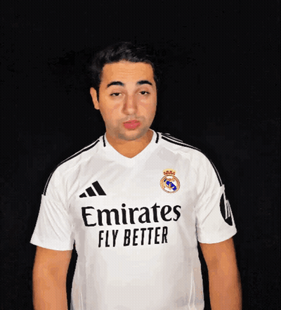 A Man Wearing A White Emirates Fly Better Jersey Blows A Kiss GIF