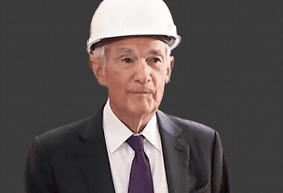 A Man Wearing A White Hard Hat And A Suit GIF
