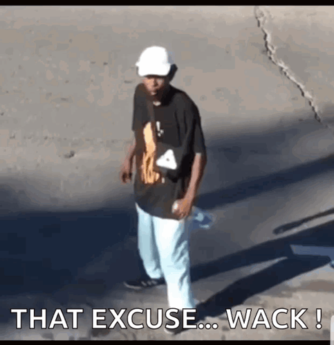 A Man Wearing A White Hat And A Black Shirt Is Walking Down The Street With The Words That Excuse ... Wack . GIF