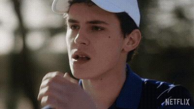 A Man Wearing A White Hat And A Blue Shirt With Netflix Written On The Bottom GIF