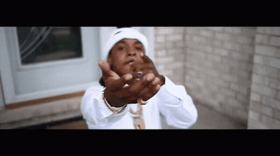A Man Wearing A White Hat And A White Shirt Is Making A Middle Finger Gesture GIF