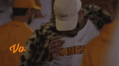 A Man Wearing A White Hat That Says " Daddy " GIF